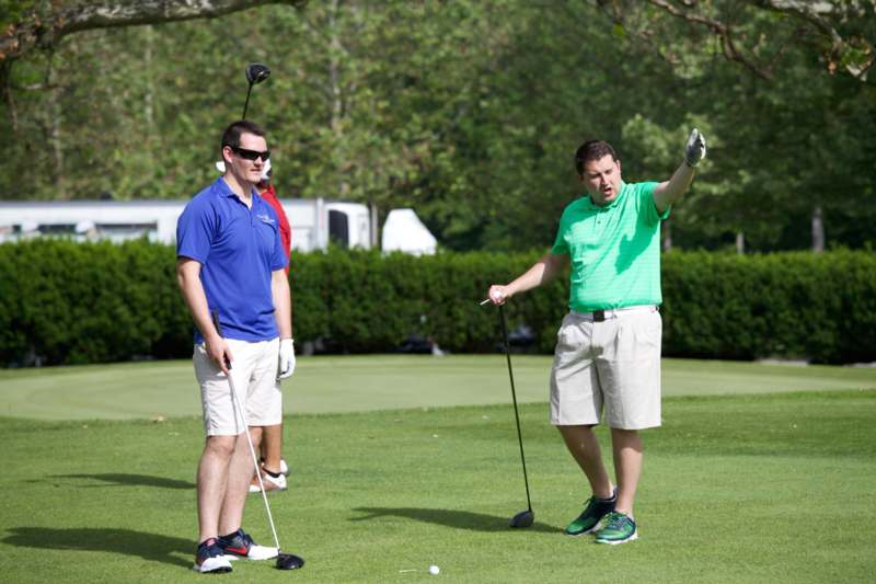 a group of men on a golf course