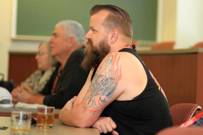 a man with a tattoo on his arm