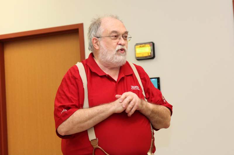 a man in red shirt and suspenders