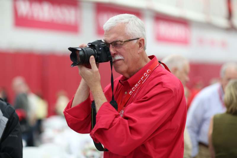 a man taking a picture with a camera