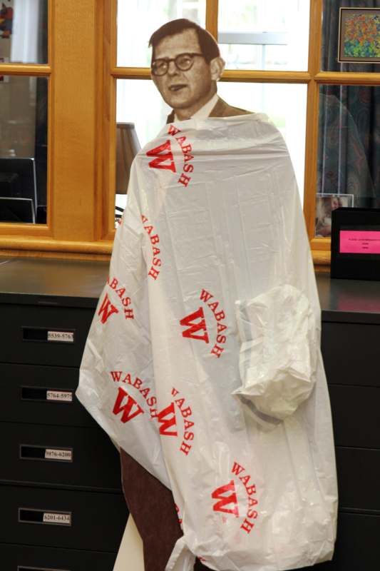 a mannequin with a plastic bag wrapped around it