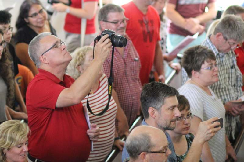 a man taking a picture of a group of people