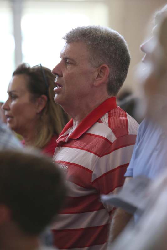 a man in a red and white striped shirt