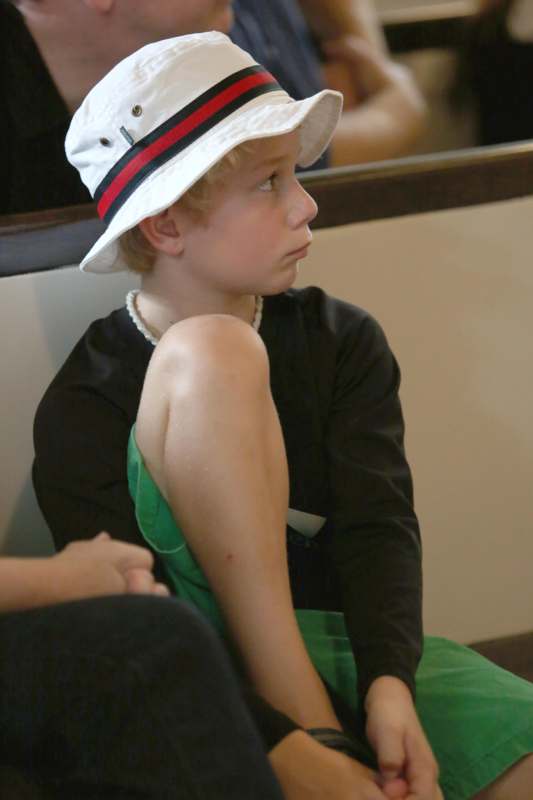 a boy wearing a white hat