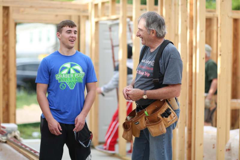 a man and a man talking in a construction site