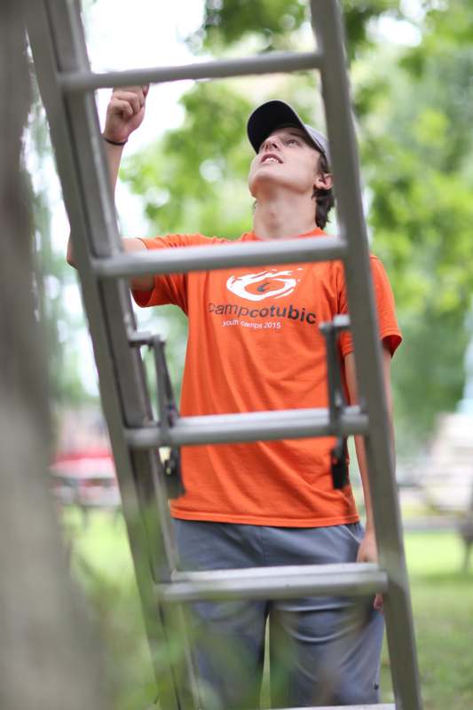 a man climbing a ladder
