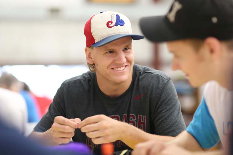 a man in a baseball cap smiling