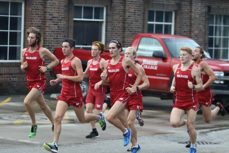 a group of people running in a race