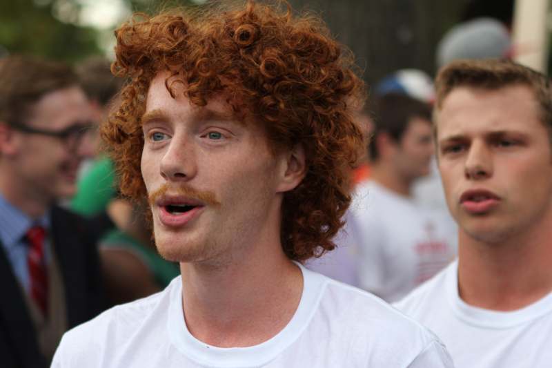 a man with curly red hair and a beard