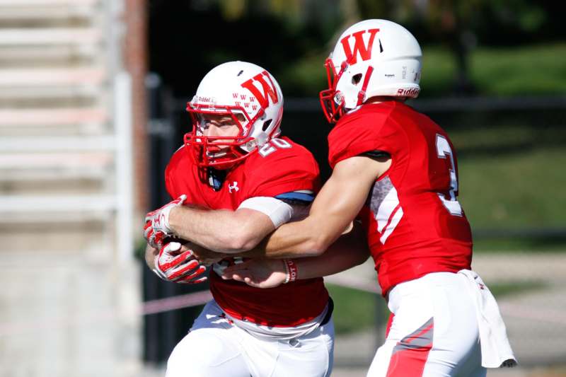 two football players in red and white uniforms
