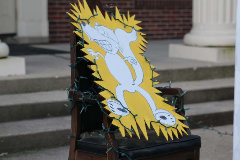 a chair with a sign on it