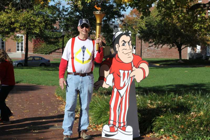 a man standing next to a cartoon character