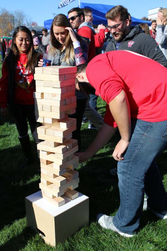 a group of people playing a game of wood blocks