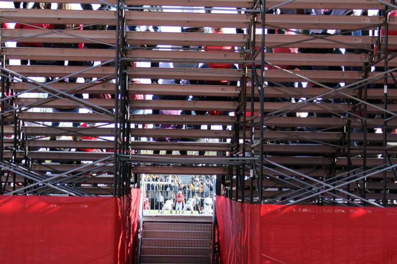 a metal stairs with red walls