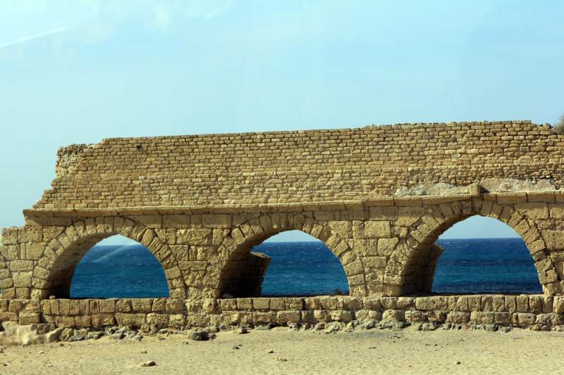 a stone bridge with arches