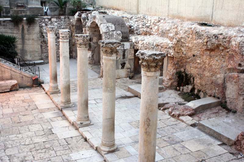 a group of pillars in a courtyard
