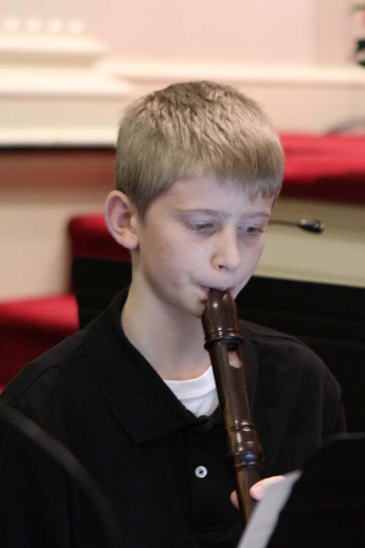 a boy playing a flute