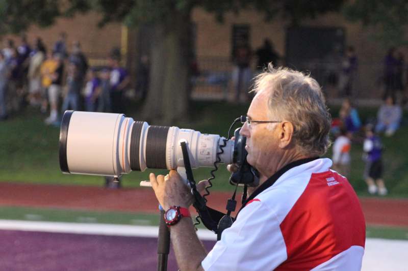 a man with a large camera