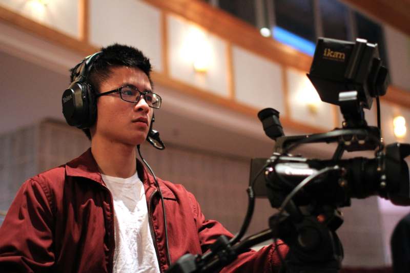 a man wearing headphones and a microphone