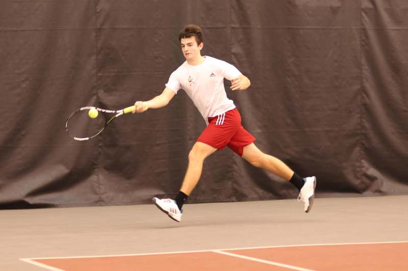a man playing tennis