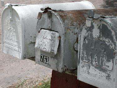 a close-up of several mailboxes