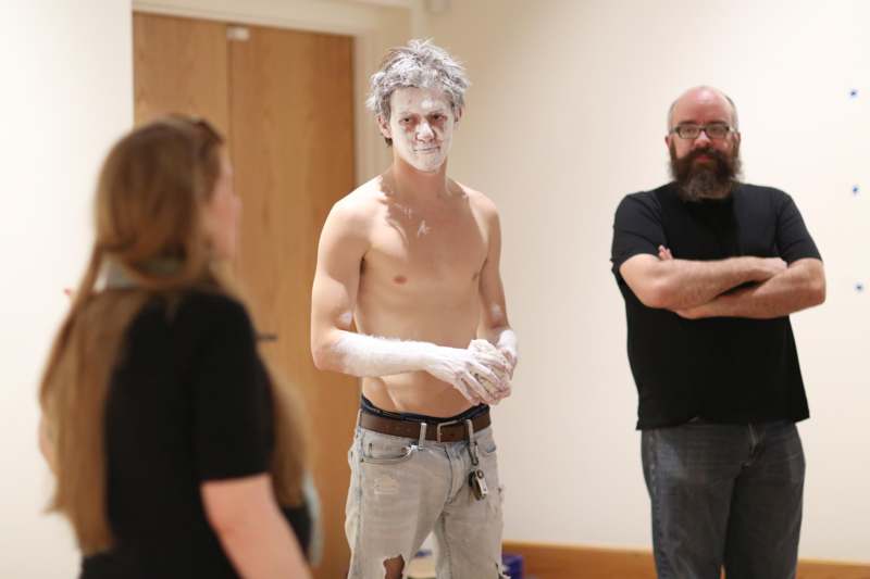 a man with white paint on his face