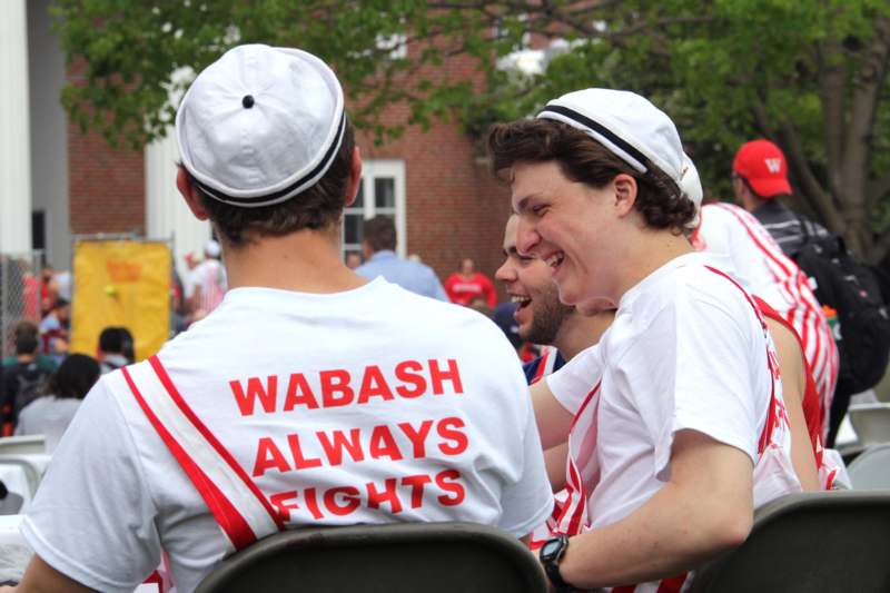 a group of men wearing white hats and shirts