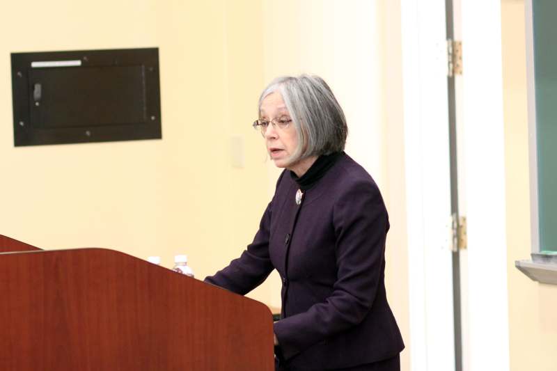 a woman standing at a podium