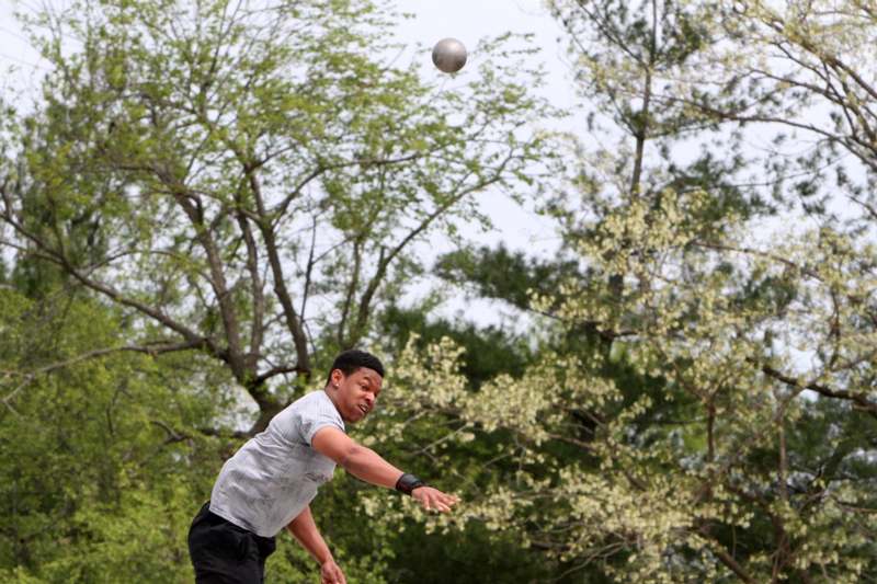 a man throwing a ball in the air