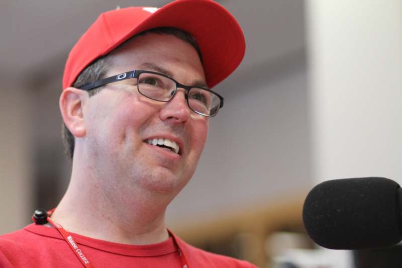 a man wearing a red hat and glasses