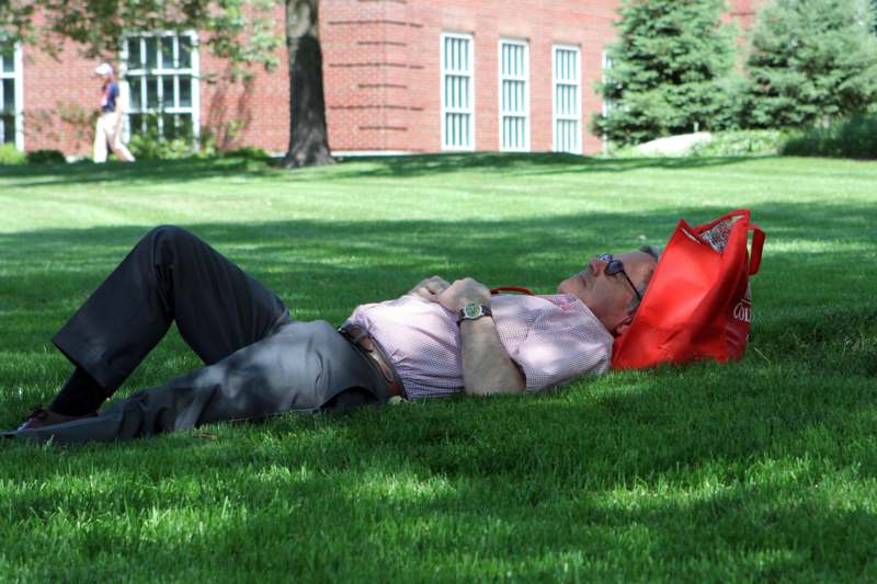 a man lying on the grass