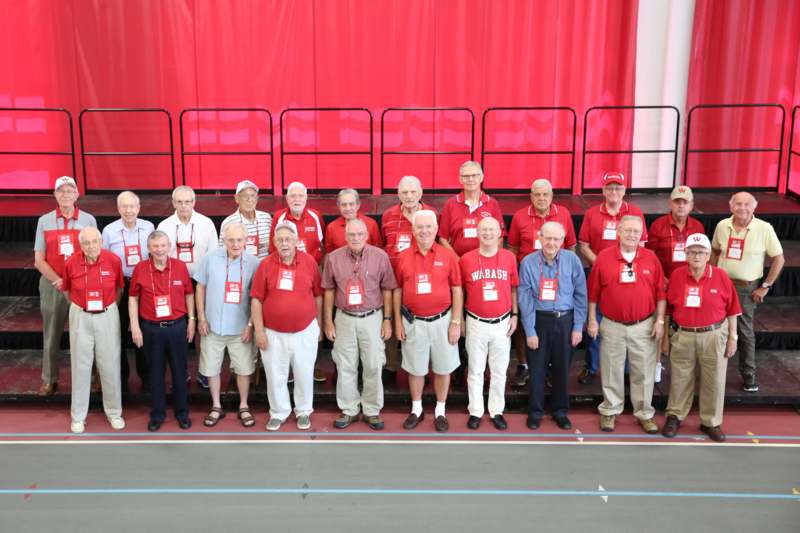 a group of people wearing matching red shirts
