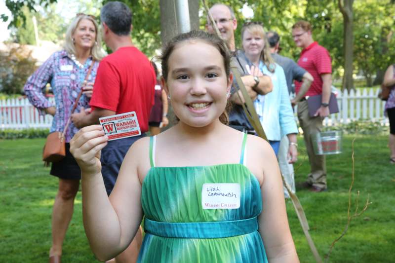 a girl holding a name tag