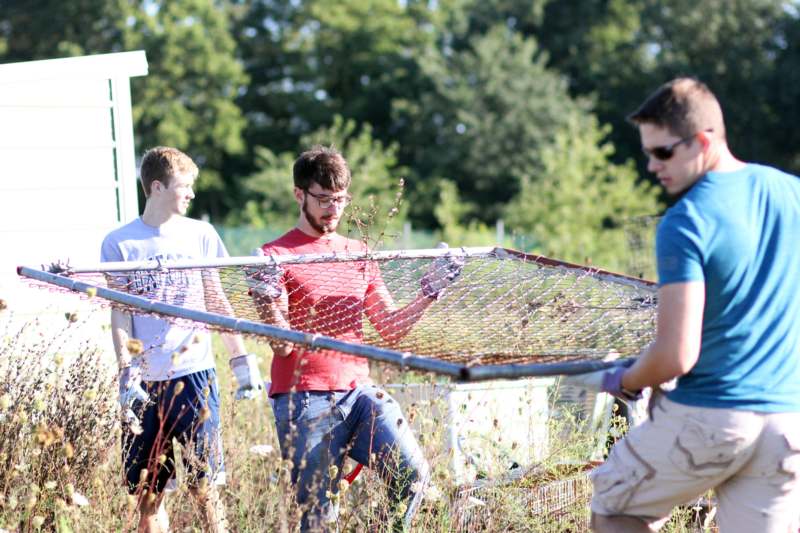 a group of men working on a net