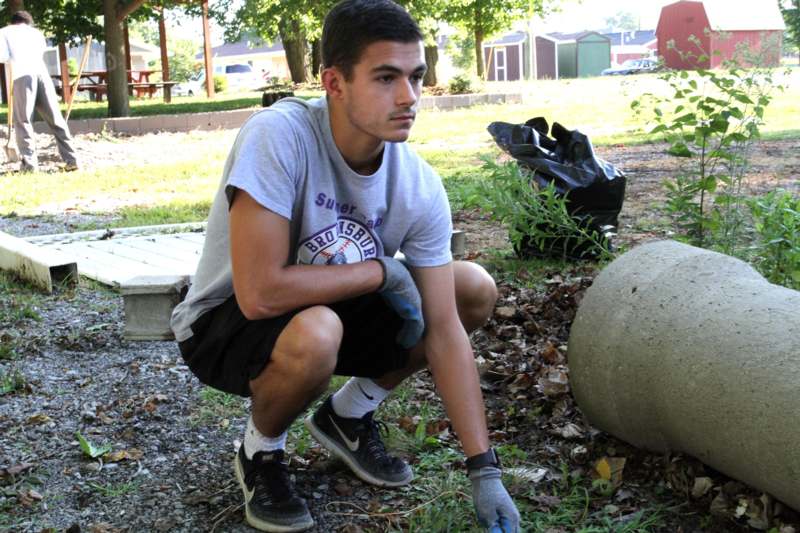 a man squatting on the ground