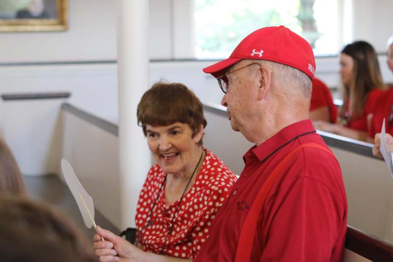 a man and woman in red shirts