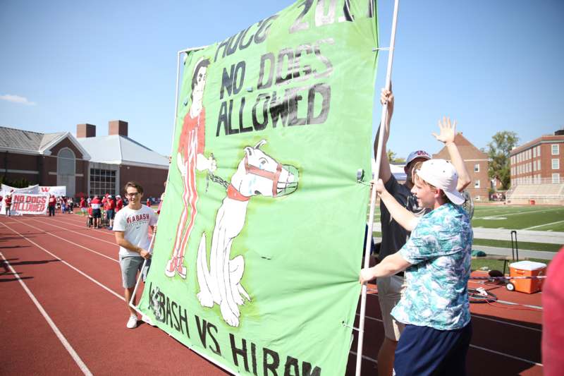 a group of people holding a banner
