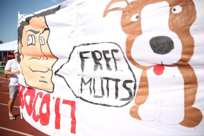 a white banner with a dog and a cartoon of a dog