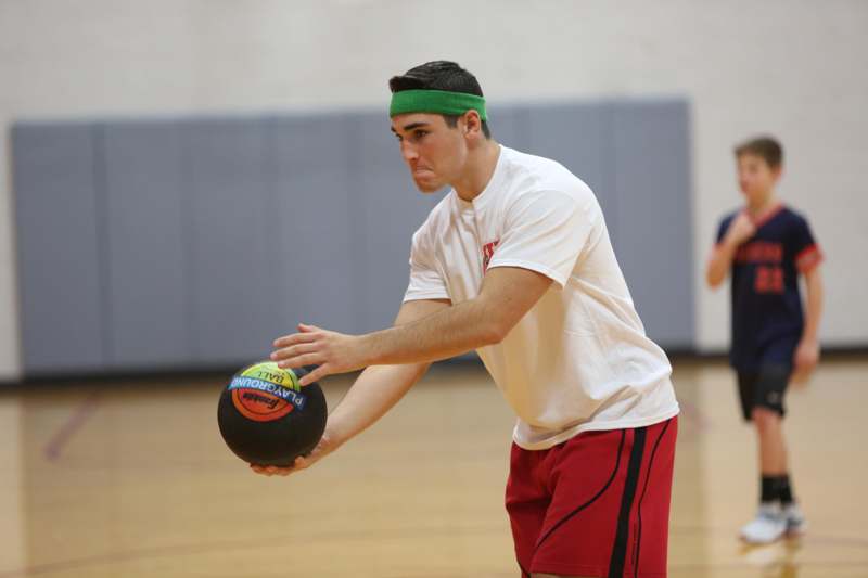a man holding a ball