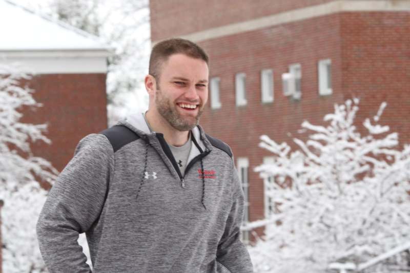 a man smiling in the snow