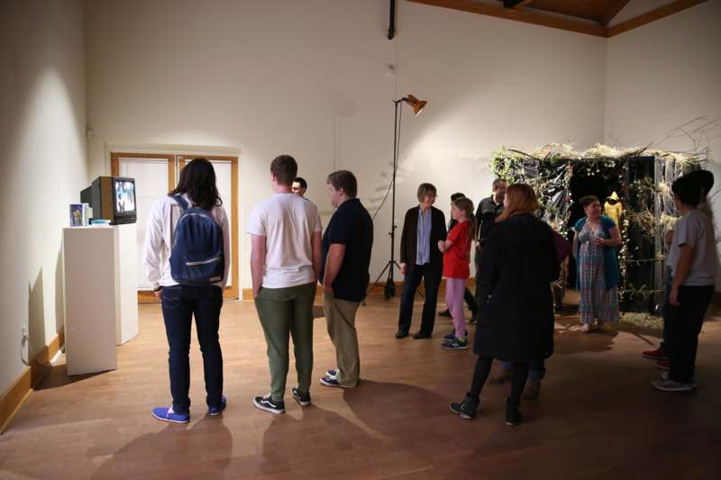 a group of people standing in a room