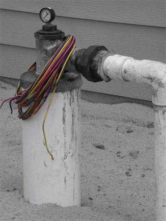 a pipe with wires attached to it