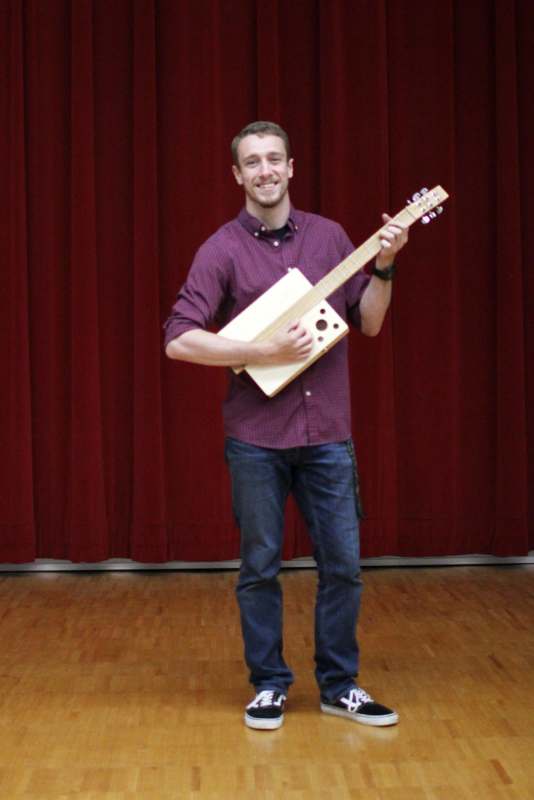 a man holding a guitar