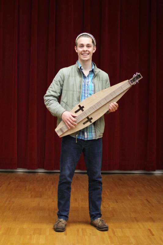 a man holding a musical instrument