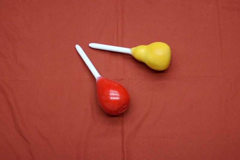 a pair of red and yellow balloons