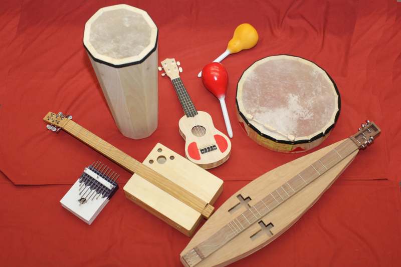 a group of musical instruments on a red surface