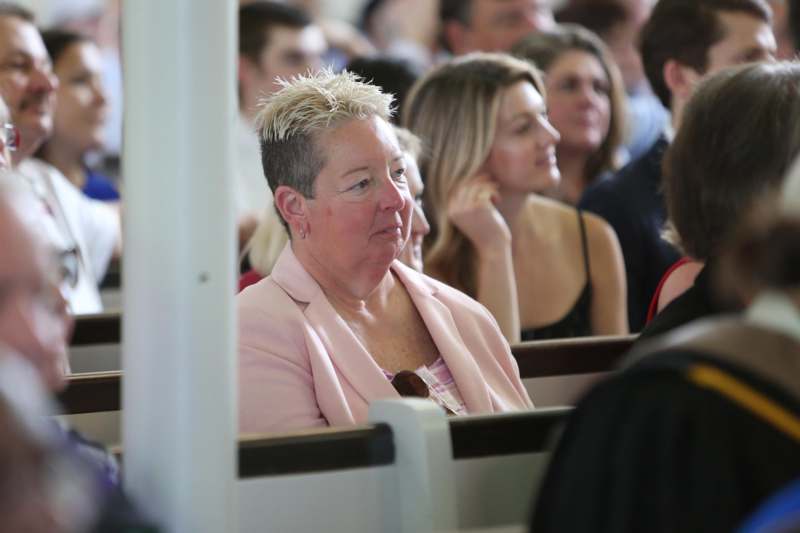 a woman sitting in a church