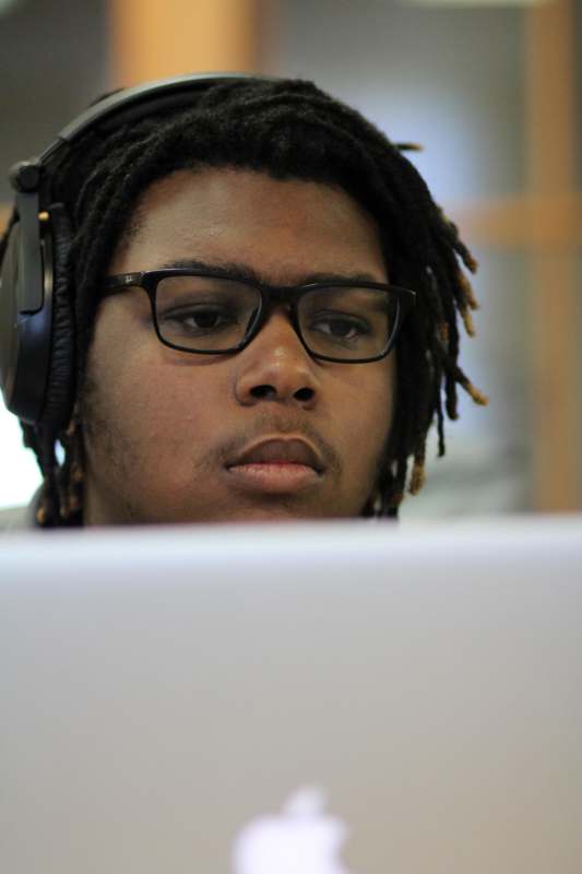a man wearing glasses and headphones