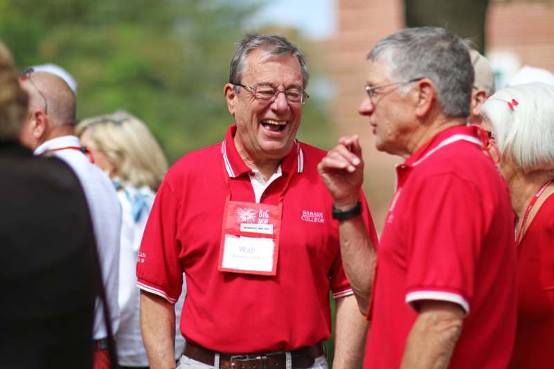 a group of men wearing red shirts