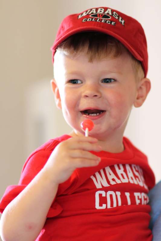a child with a lollipop
